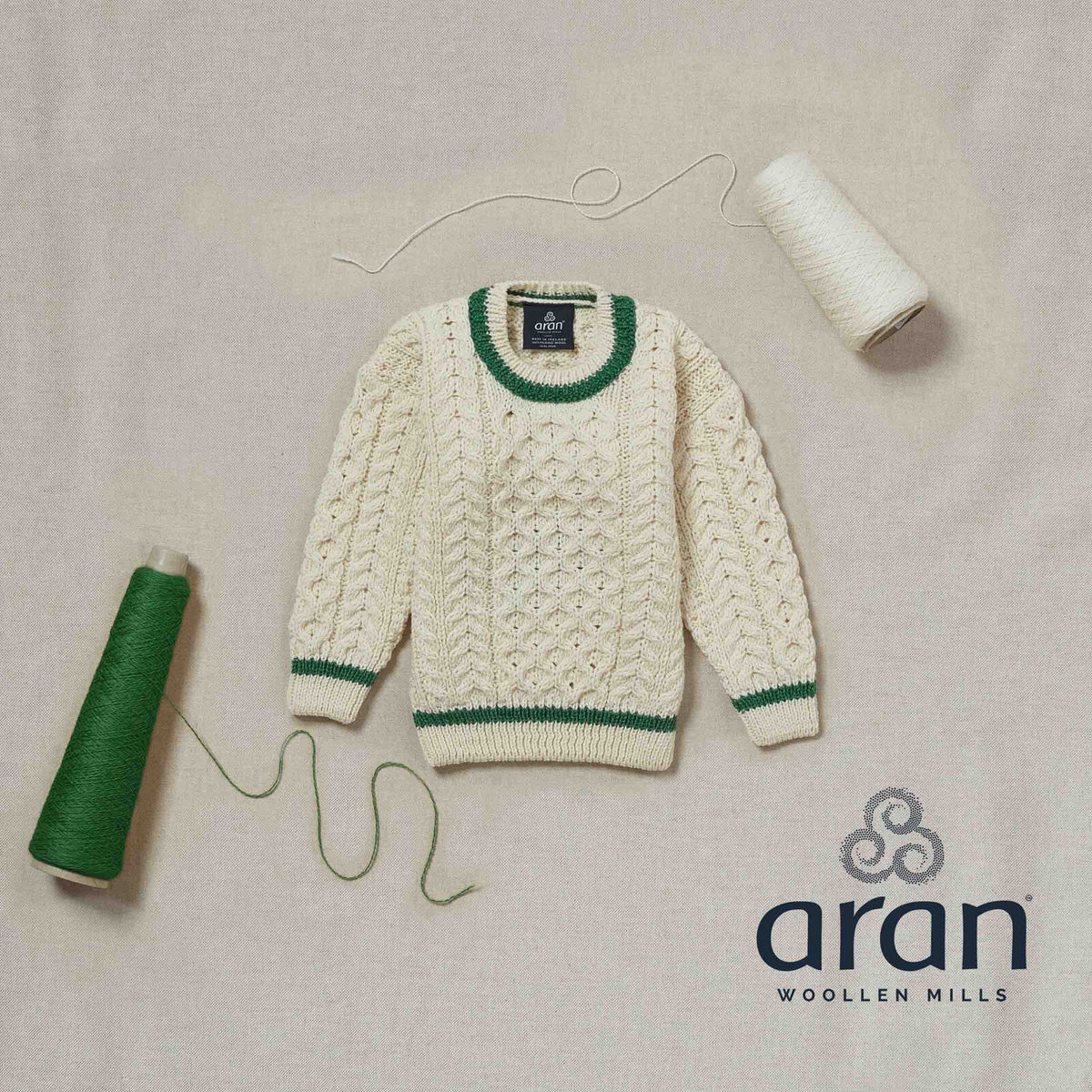 Children&#39;s Merino Wool Stripe Detail Sweater by Aran Mills - Cream/Green